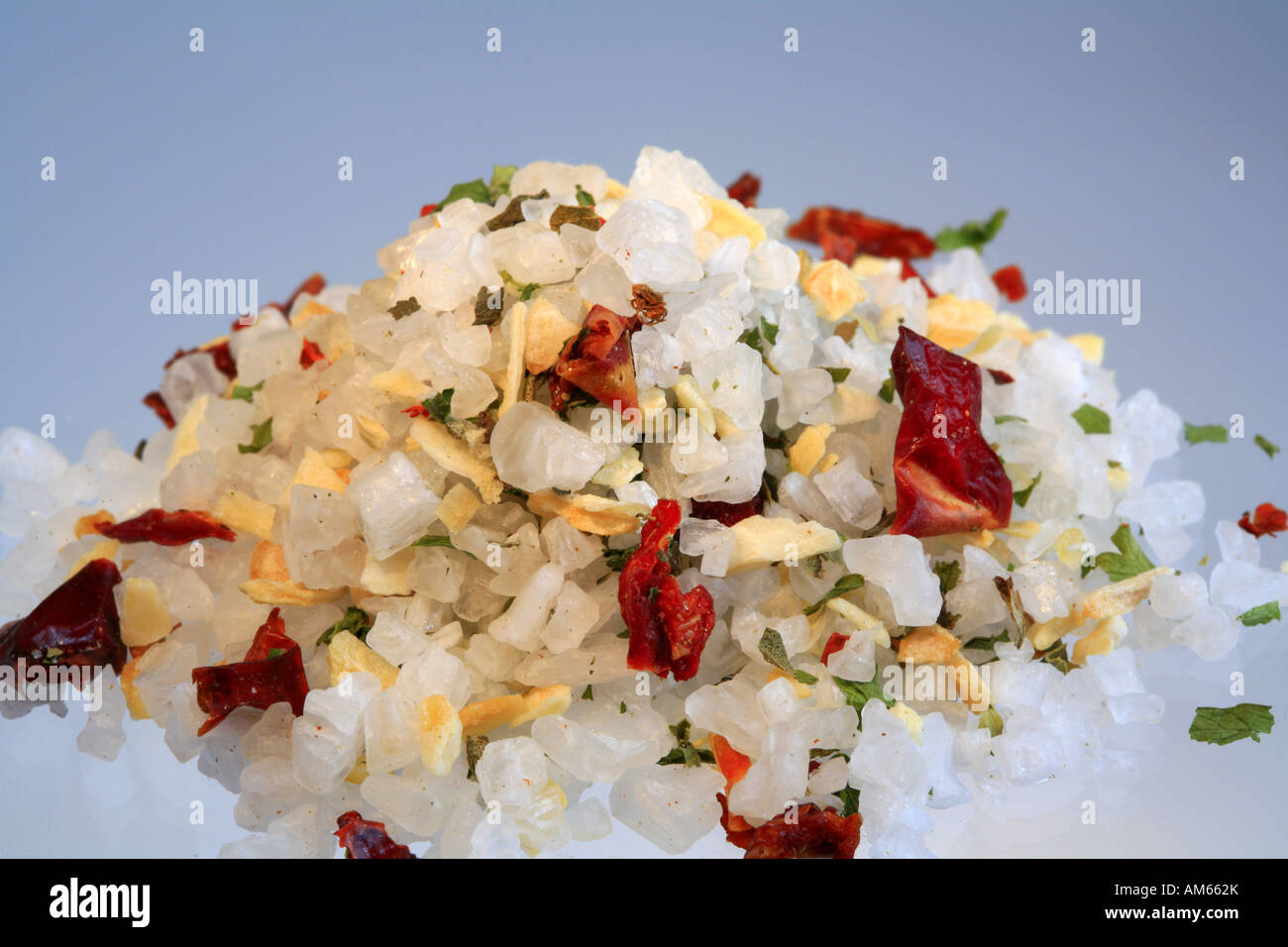 Colourful sea salt, mixture with chili, paprika, oregano, basil, garlic, onions and pepper Stock Photo