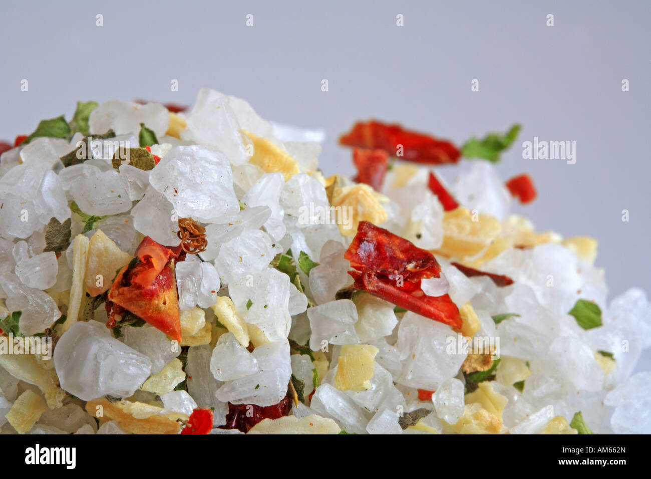 Colourful sea salt, mixture with chili, paprika, oregano, basil, garlic, onions and pepper Stock Photo