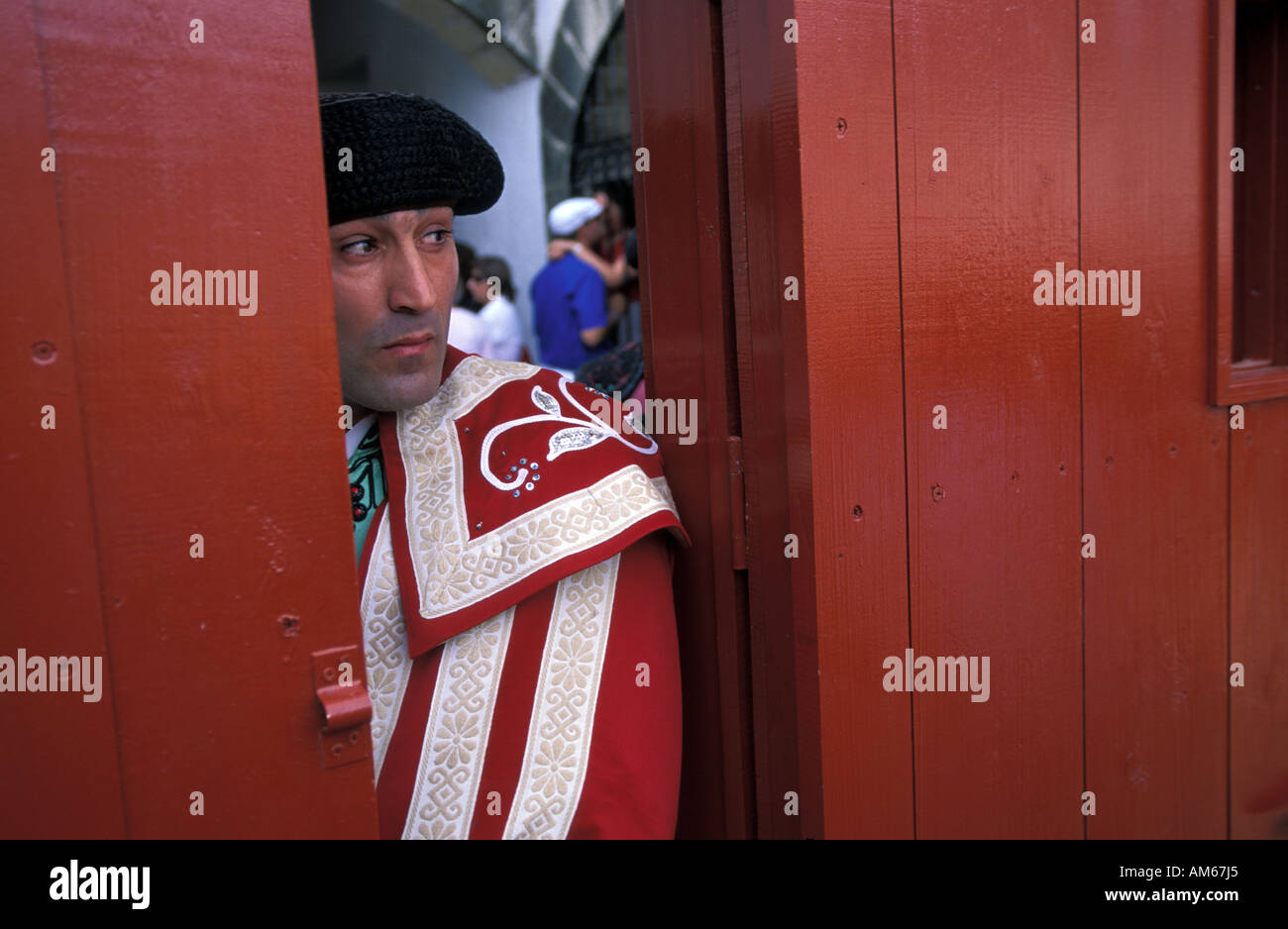 A bullfighter watches the arena in anticipation before his bullfight Stock Photo