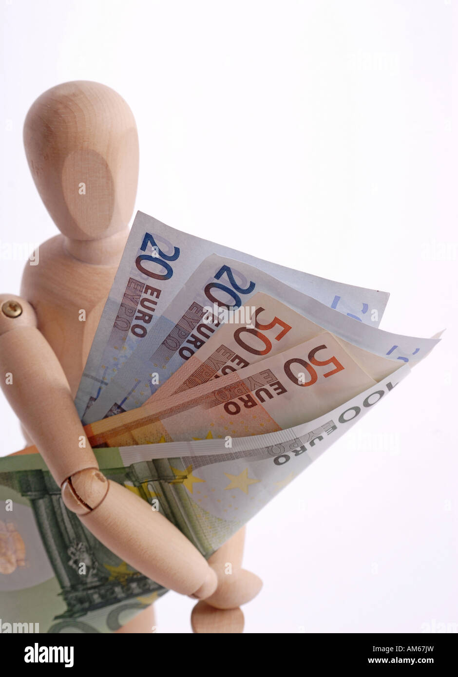 Wooden doll with Euro bills Stock Photo
