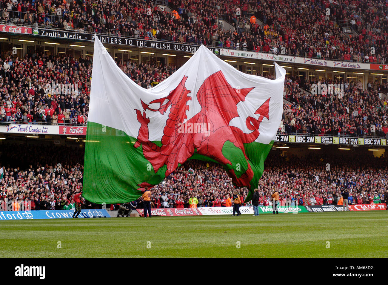Cardiff Millenium Stadium Giant Welsh Flag Red Dragon is unfurled before a Rugby International Stock Photo