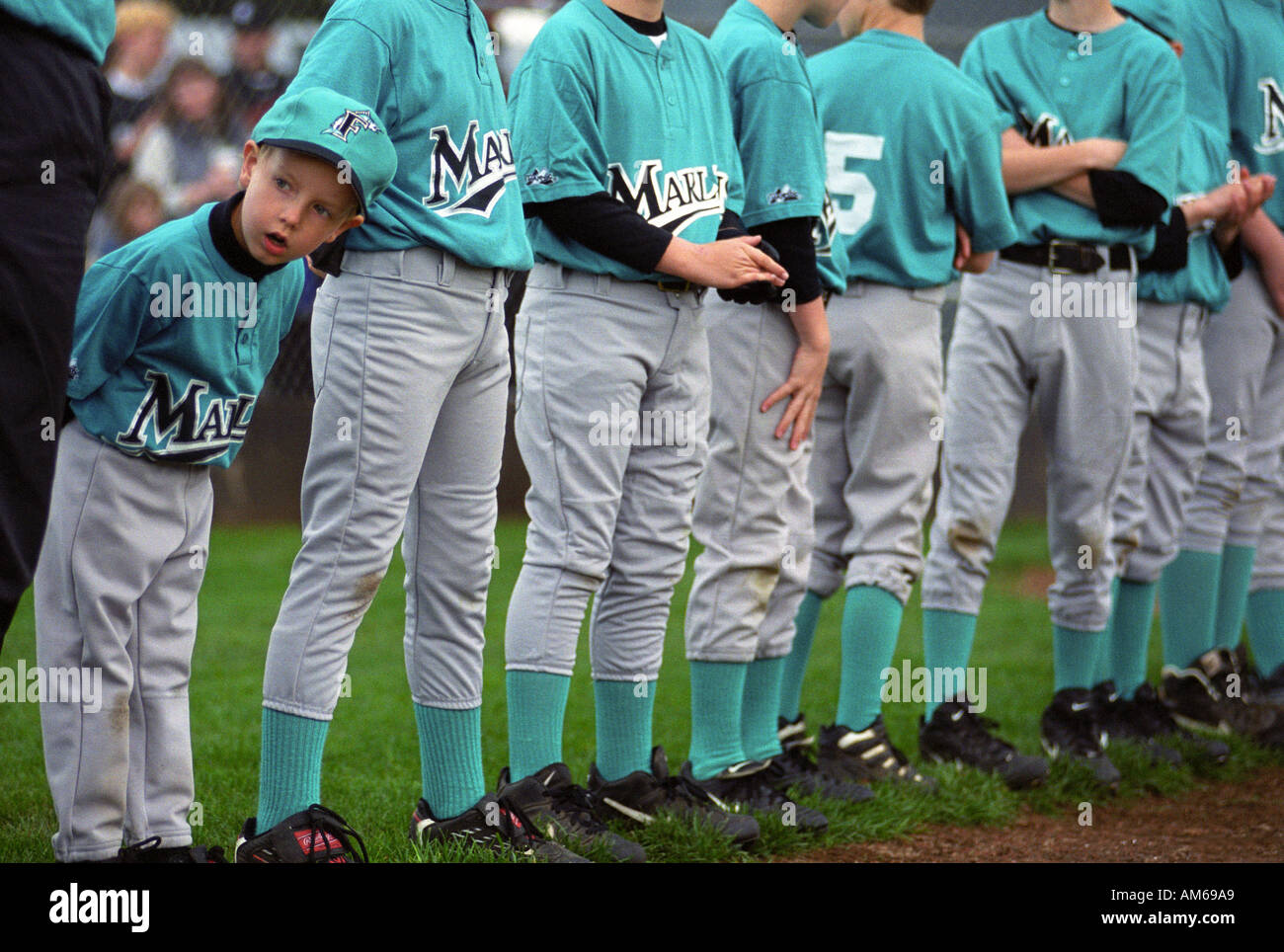Smallest kid at baseball tryouts Stock Photo - Alamy