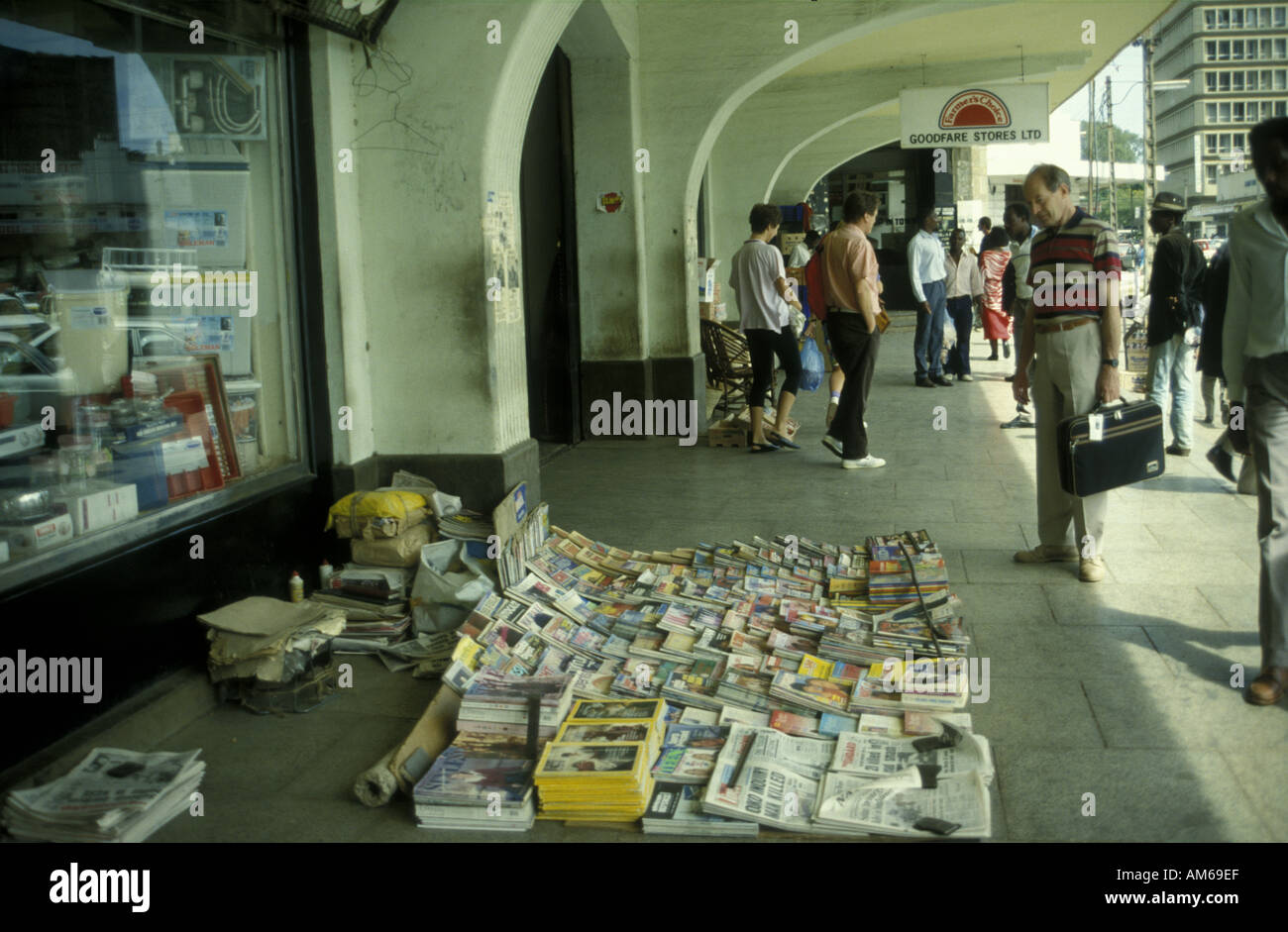 Magazines and newspapers on sale on the pavement at the main entrance to the City Market Stock Photo
