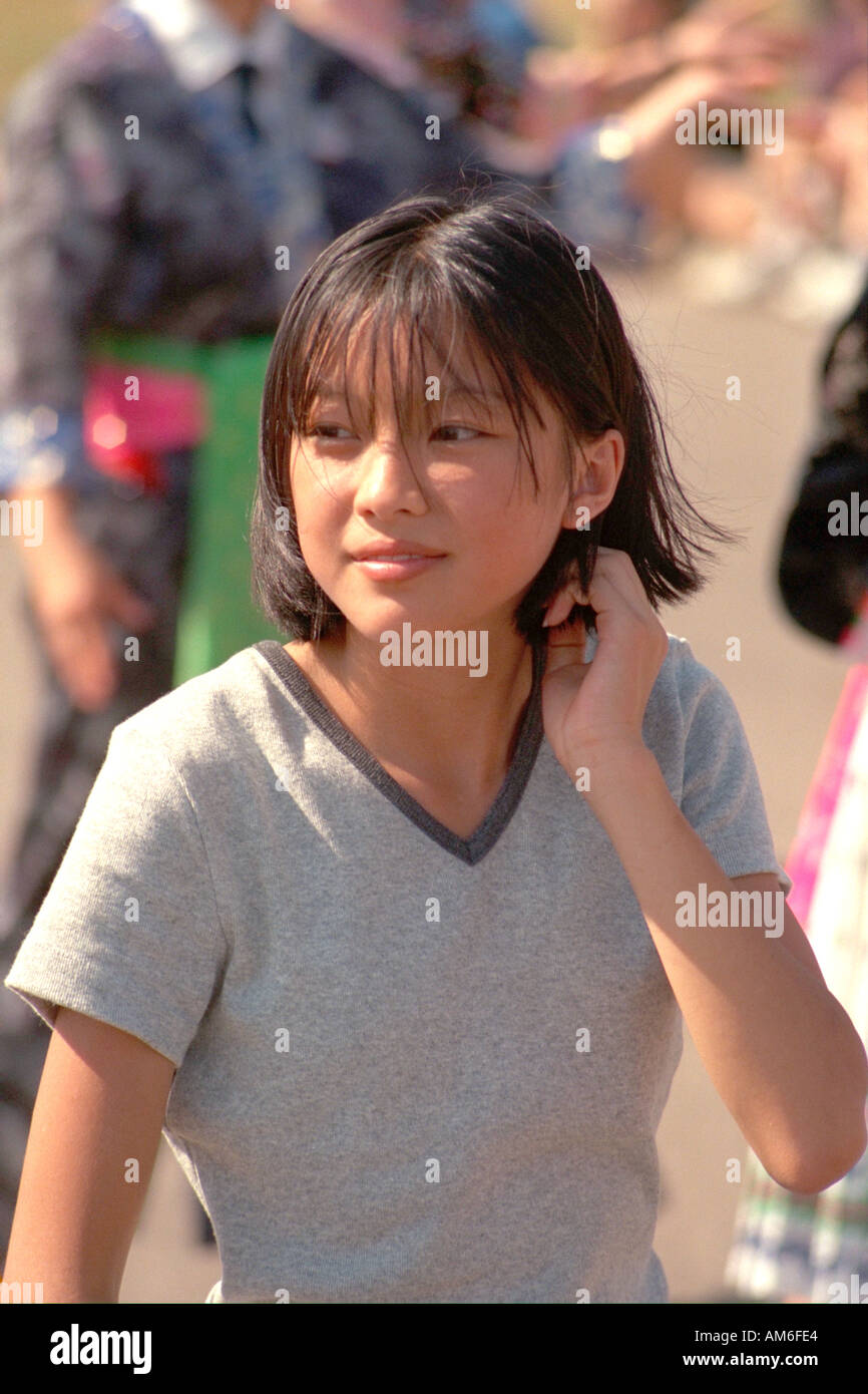 Attractive Asian Girl Age 15 Looking Curious At Asian American Festival St Paul Minnesota Usa 