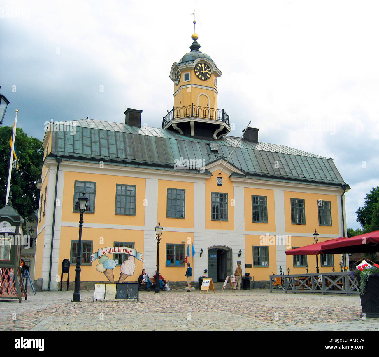 The wooden town hall house and clock tower at Rådhustorget square in idyllic Söderköping Sweden Stock Photo