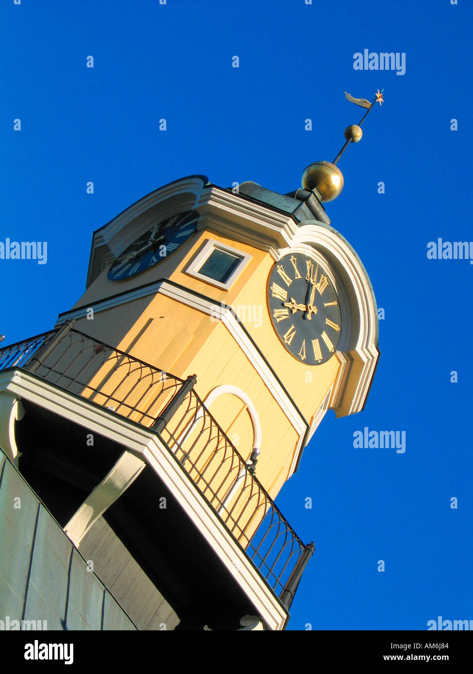 The clock tower of the wooden town hall house at Rådhustorget square in idyllic Söderköping Sweden Stock Photo