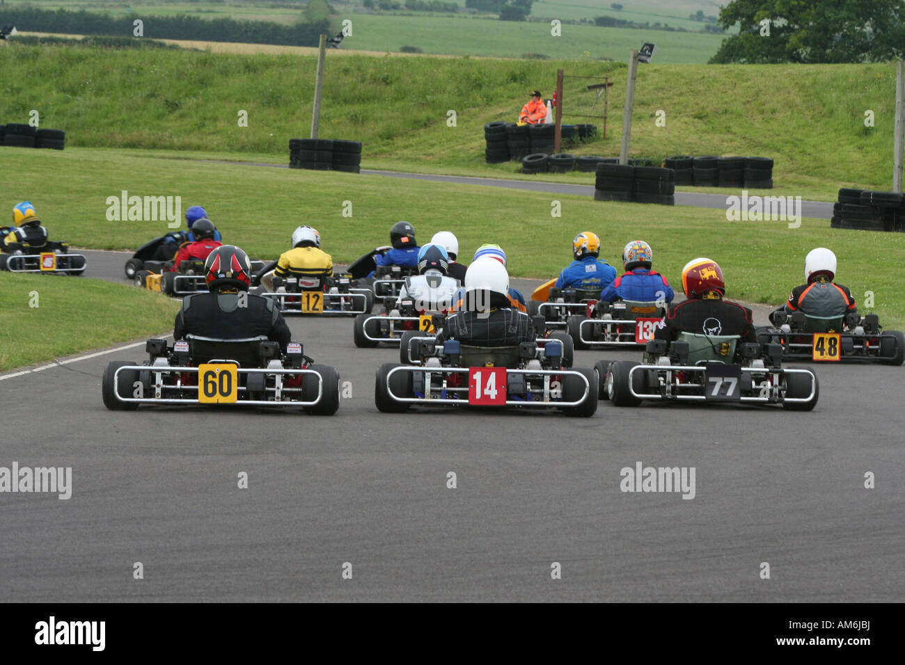 Rear view of the start of a go kart race taken on the first corner