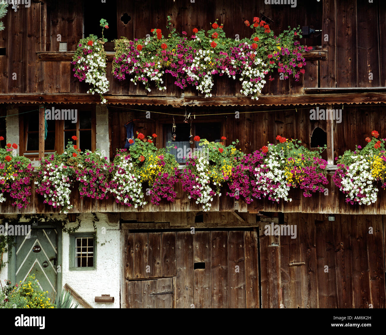 Flower decoration on a farmhouse, Chiemgau, Upper Bavaria, Germany Stock Photo