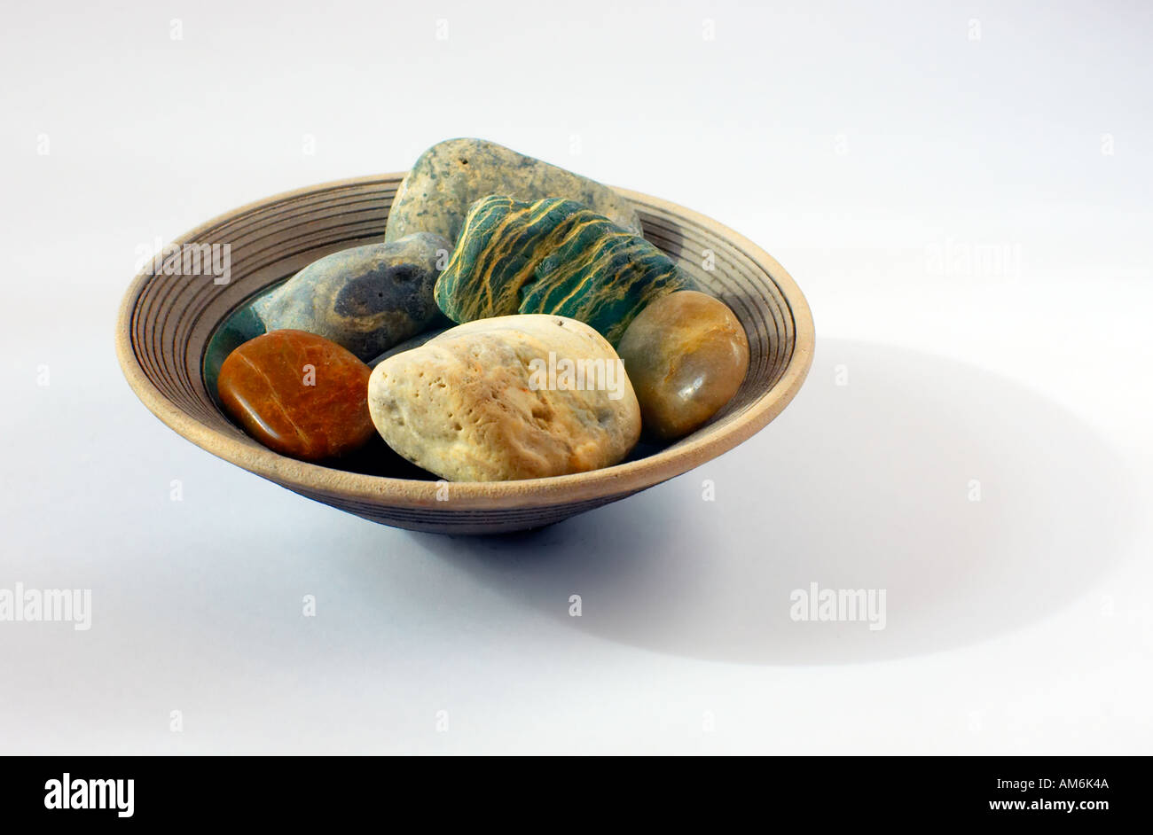 Stones in bowl Stock Photo Alamy
