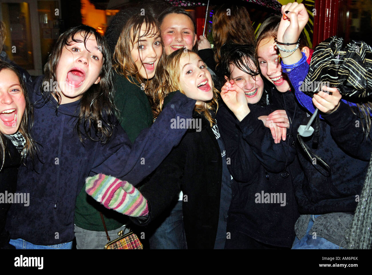 Group of youngsters having fun in the rain during Hampton Hill