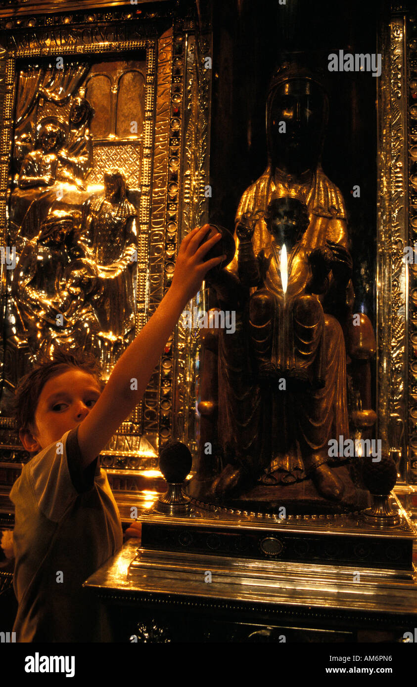 Montserrat a pilgrim touches La the patron saint of Catuna