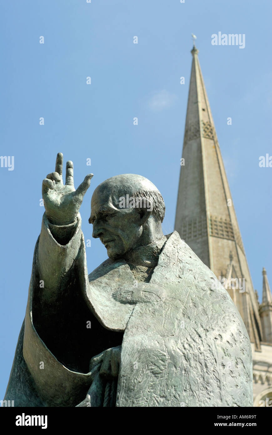 Statue of St Nicholas at Chichester with cathedral spire in background Vertical Format Stock Photo