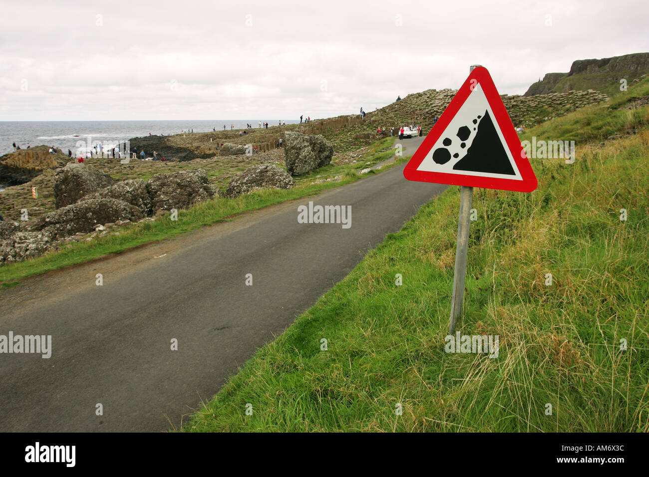 Rock fall warning sign near Giants Causeway car park and cliffs, County Antrim Northern Ireland United Kingdom Britain Stock Photo