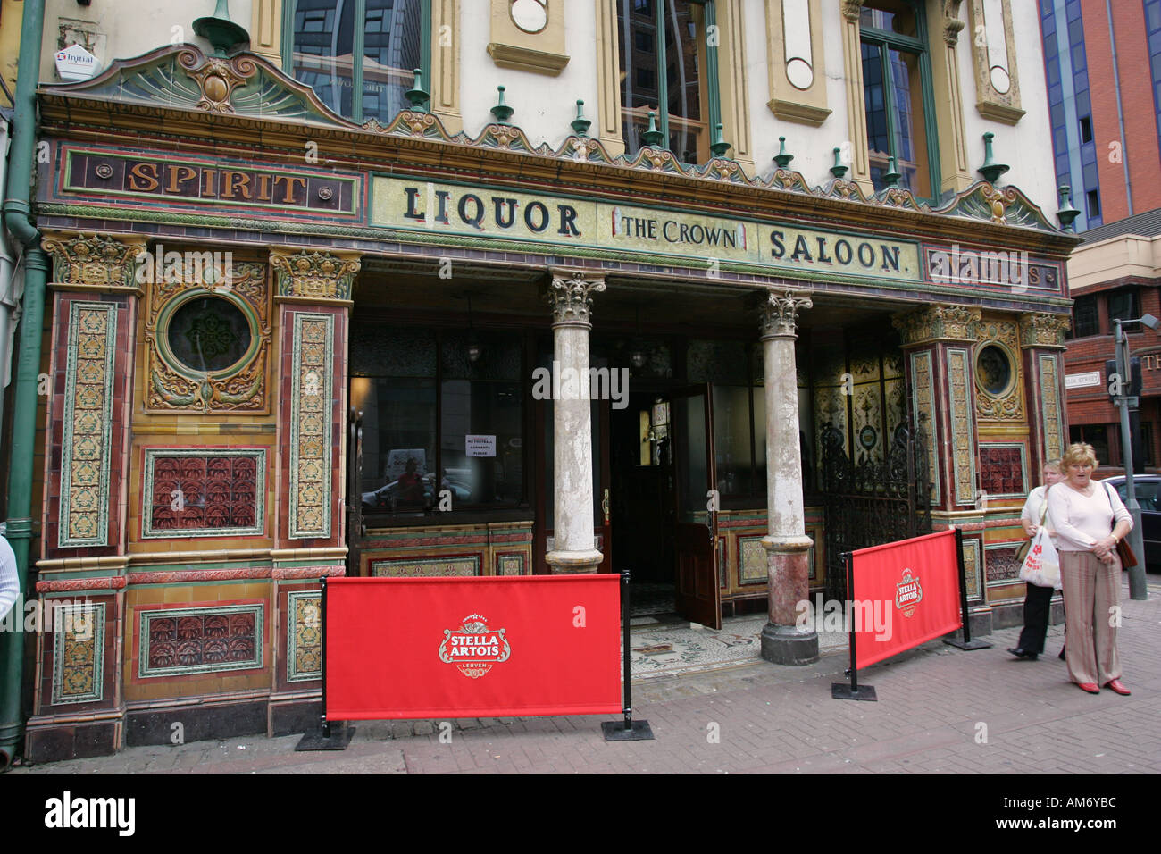 Tourists stand outside the world famous Belfast Irish pub The Crown