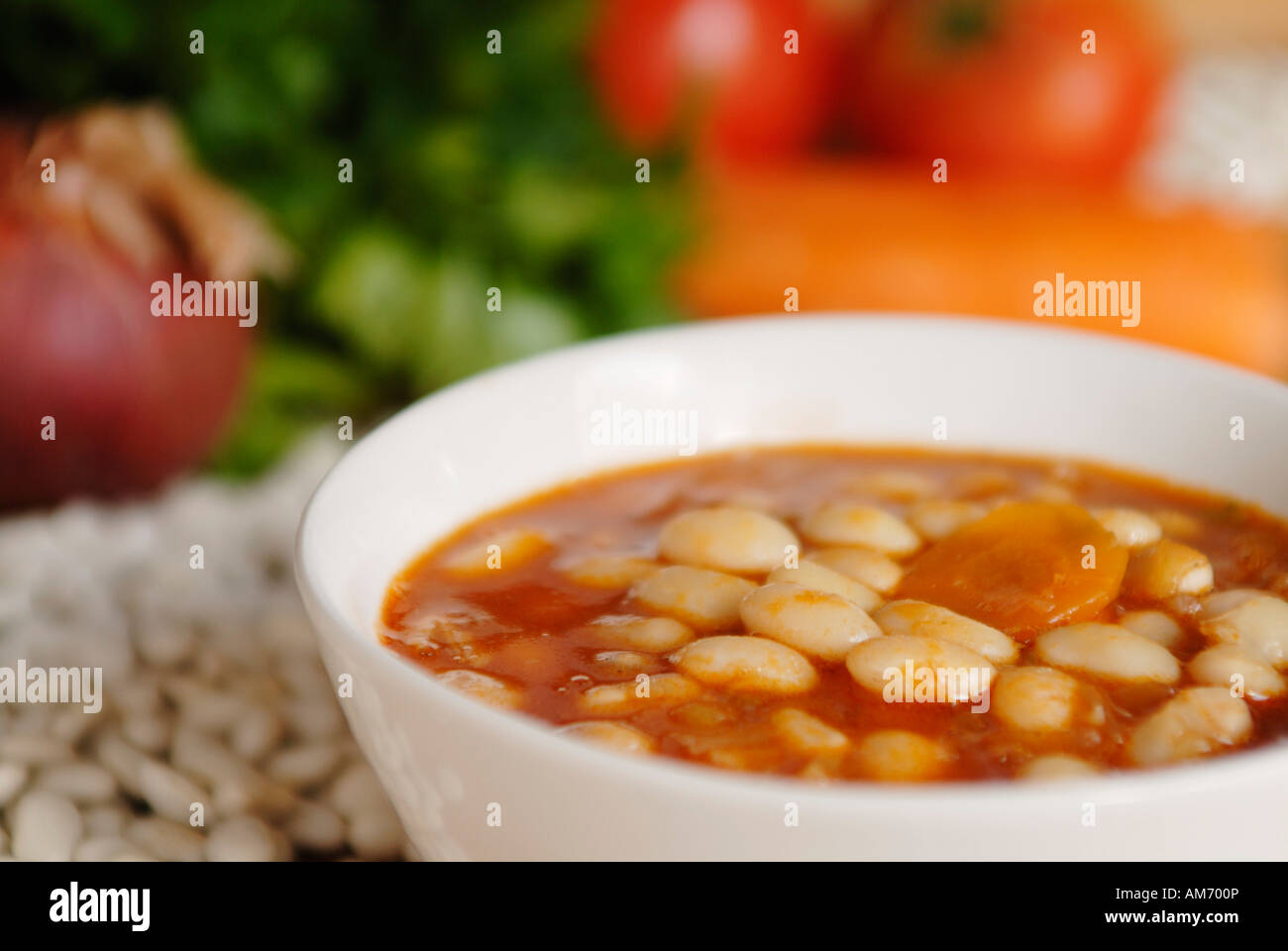 Fasolada traditional Greek white beans soup with celery carrots tomato