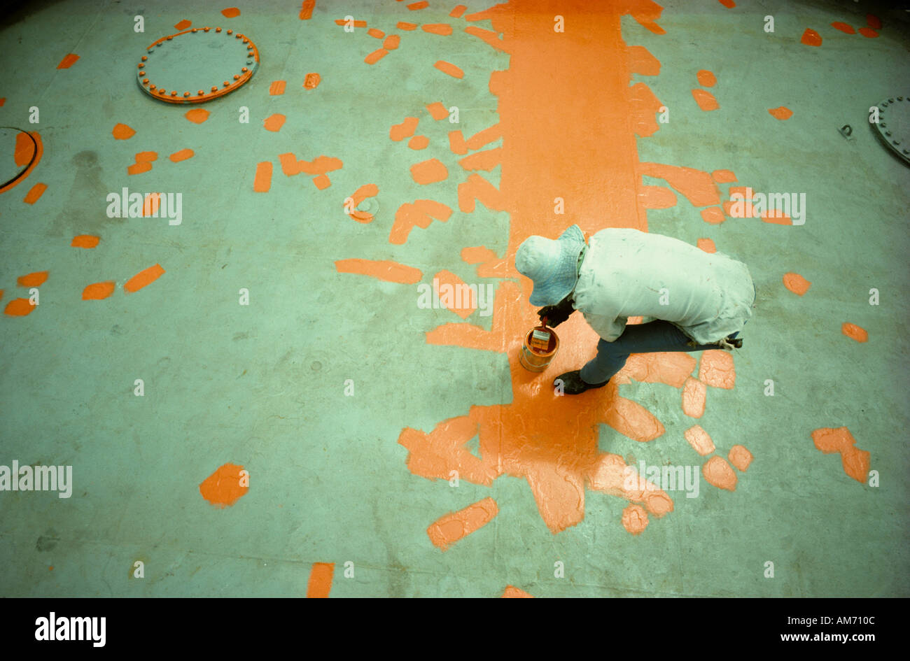 Painting deck of work boat in offshore oil field Stock Photo Alamy