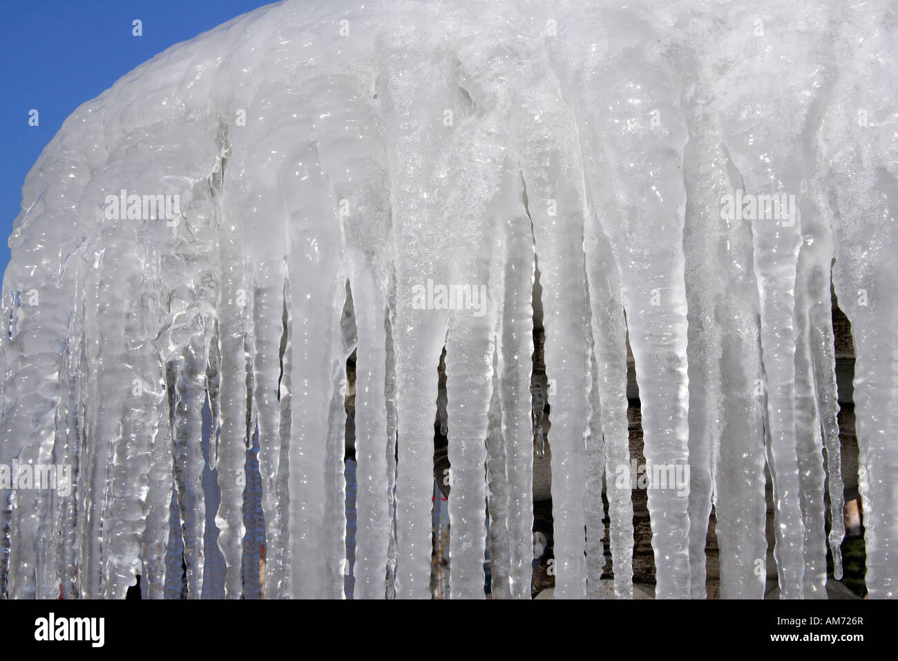 Icicles hanging on a fountain Stock Photo