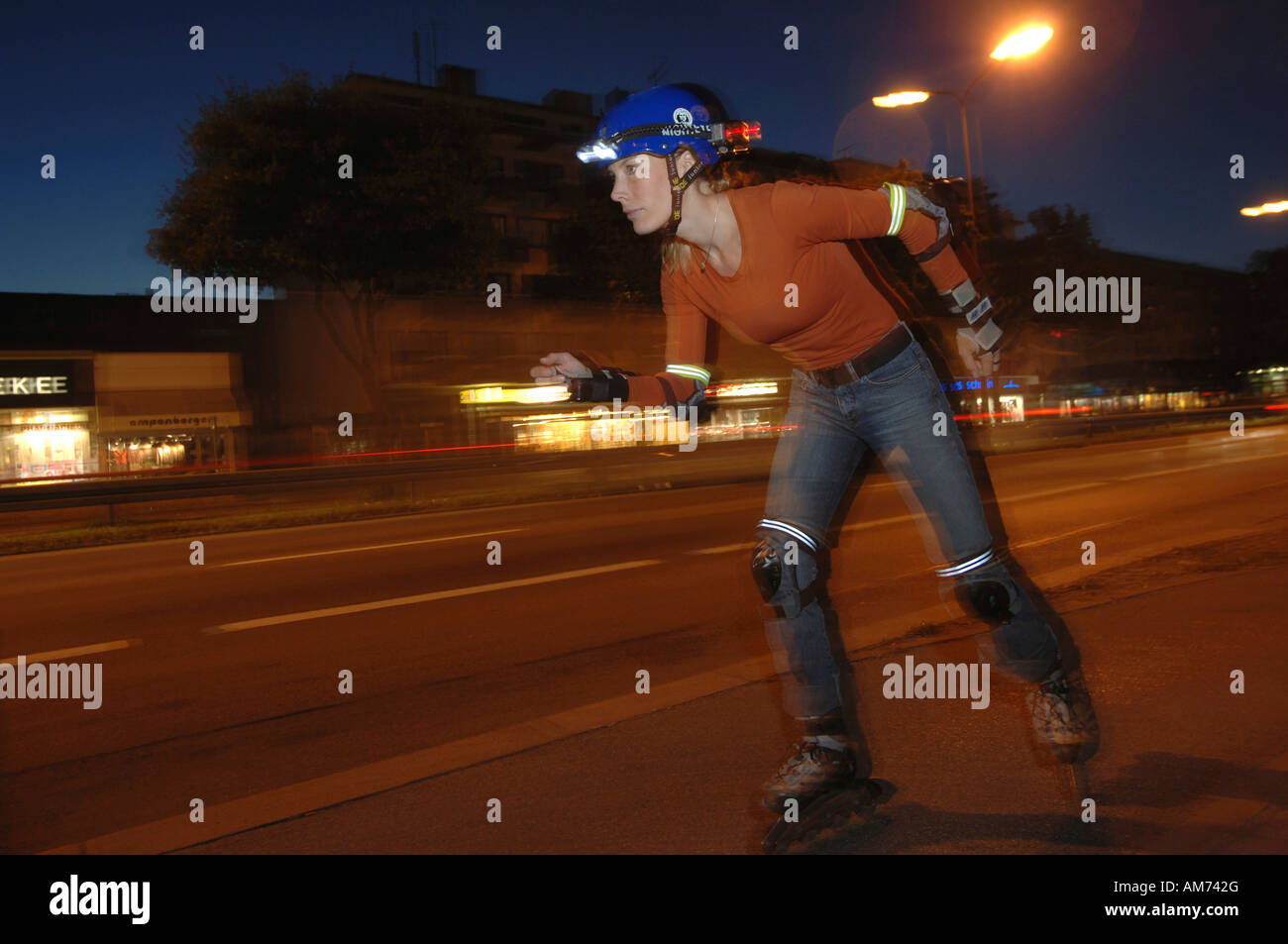 Rollerblader with lighting at dusk Stock Photo