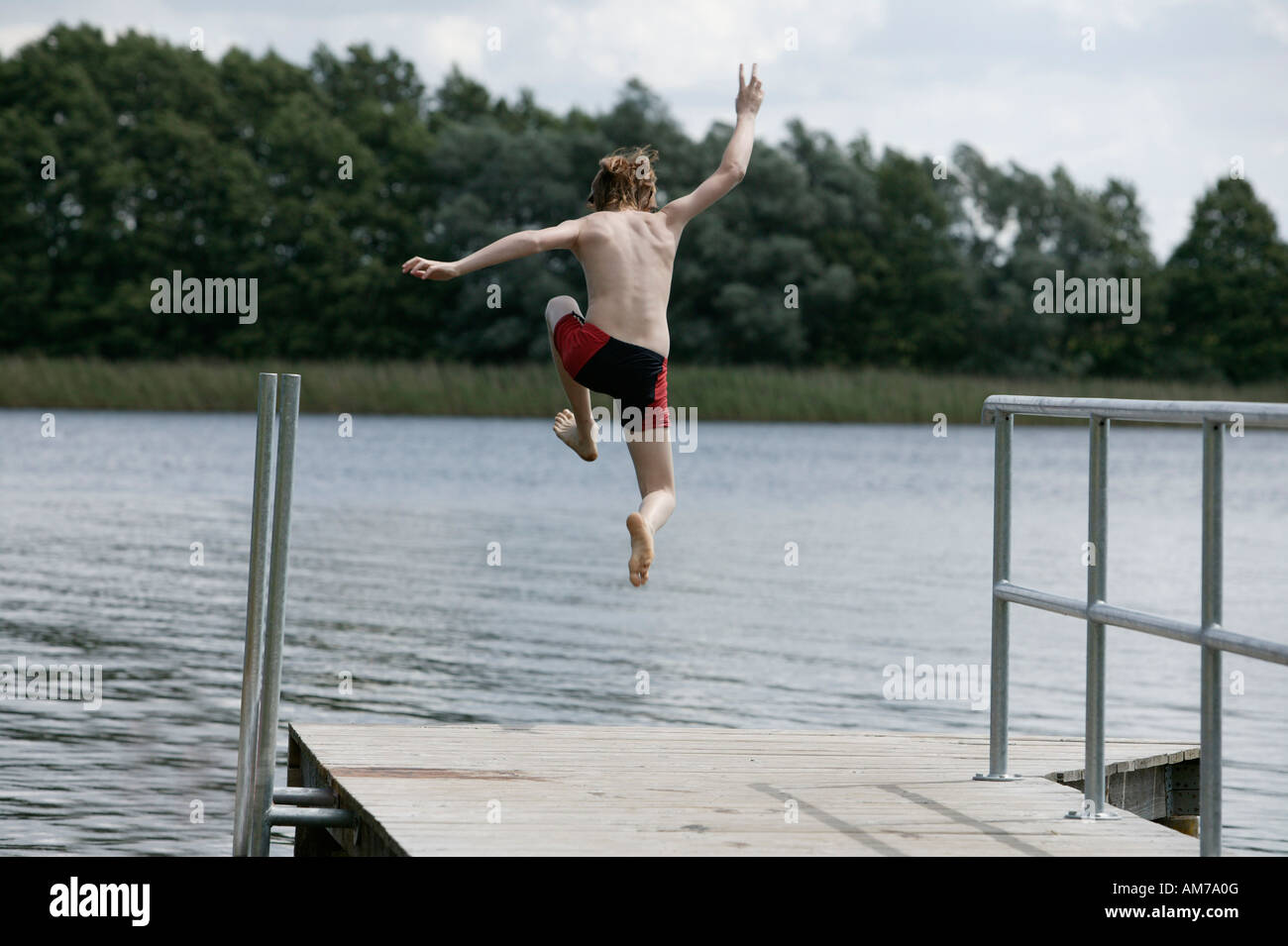 Boy in a lake hi-res stock photography and images - Alamy