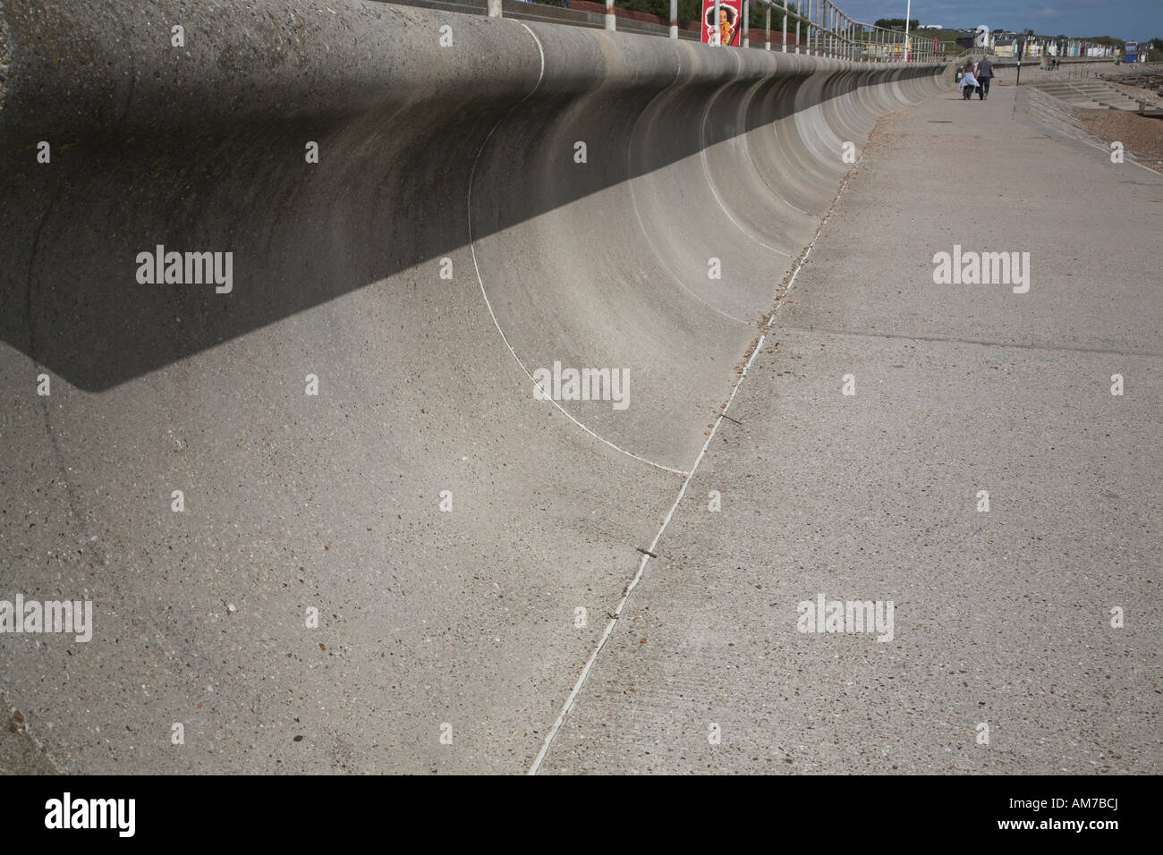 Wave return wall, north Felixstowe, Suffolk, England Stock Photo