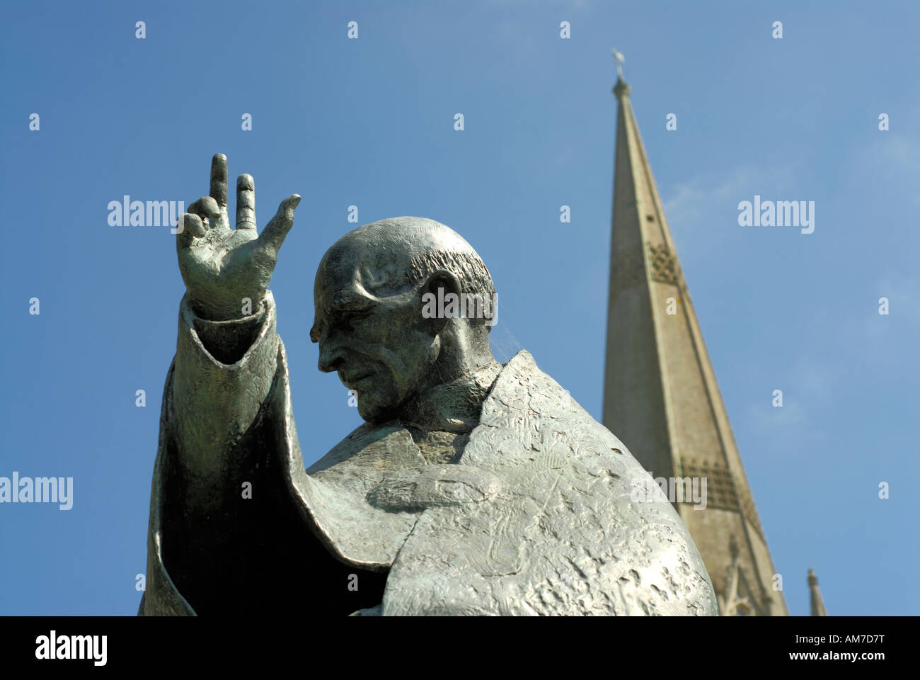 Statue of St Nicholas at Chichester with cathedral spire in background horizontal Format Stock Photo