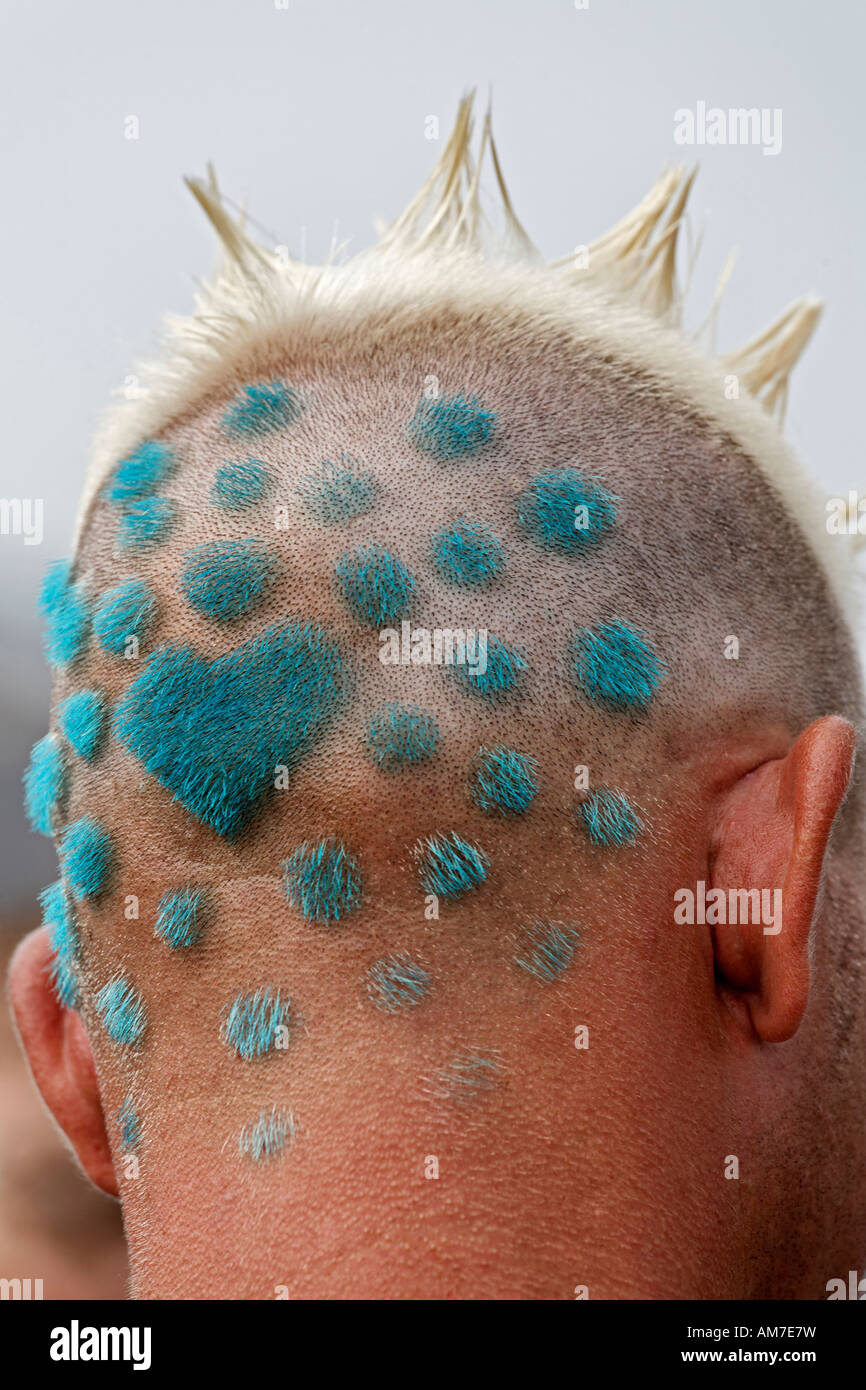 Shaved and coloured back of male head showing the logo design of the Loveparade 2007, Essen, NRW, Germany Stock Photo