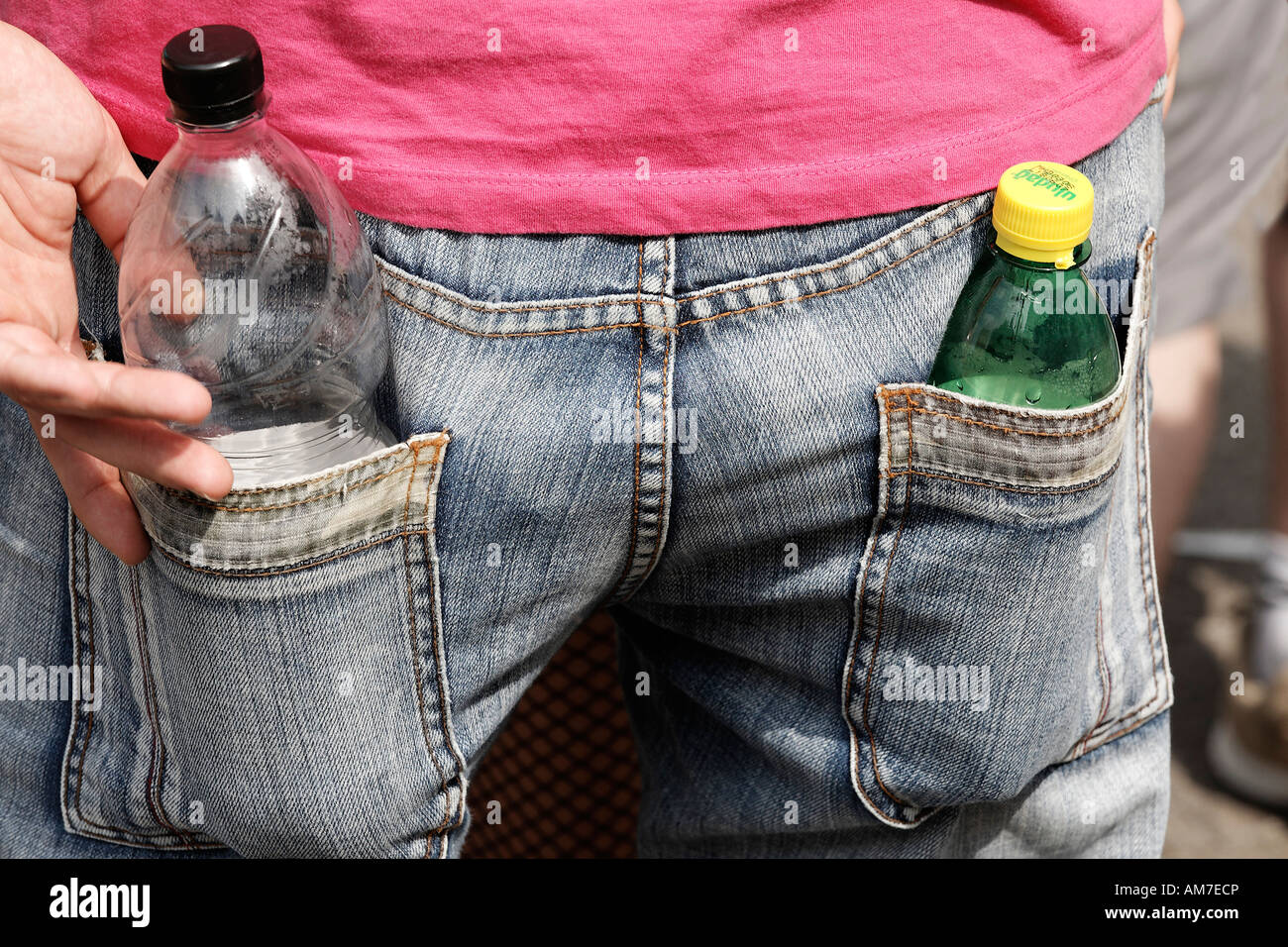 Two plastic bottles put into back pockets of jeans, Loveparade 2007, Essen,  NRW, Germany Stock Photo - Alamy