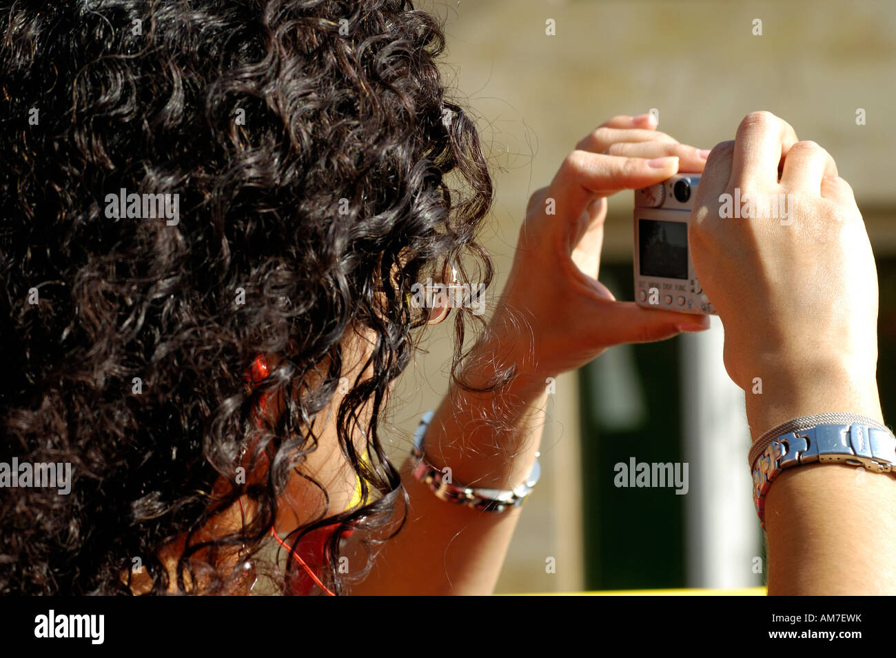 Woman using digital compact camera photography, Spain Stock Photo - Alamy