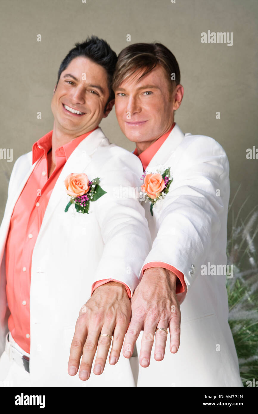 Gay couple showing off wedding rings Stock Photo - Alamy