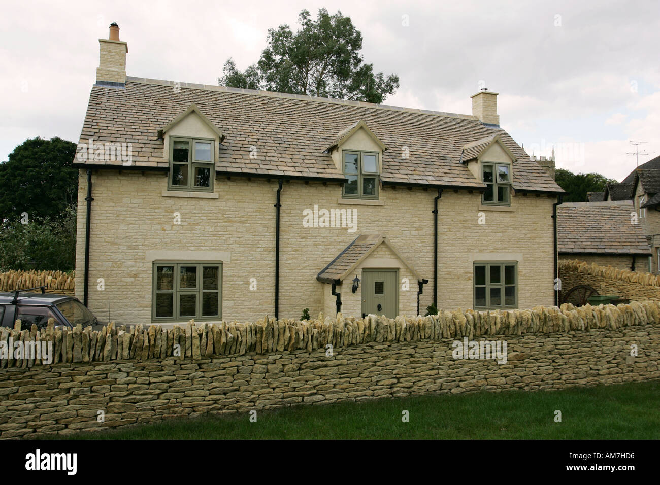 Typical newly built detached Oolitic limestone Cotswold family house cottage home the Cotswolds Southern England UK GB Britain Stock Photo