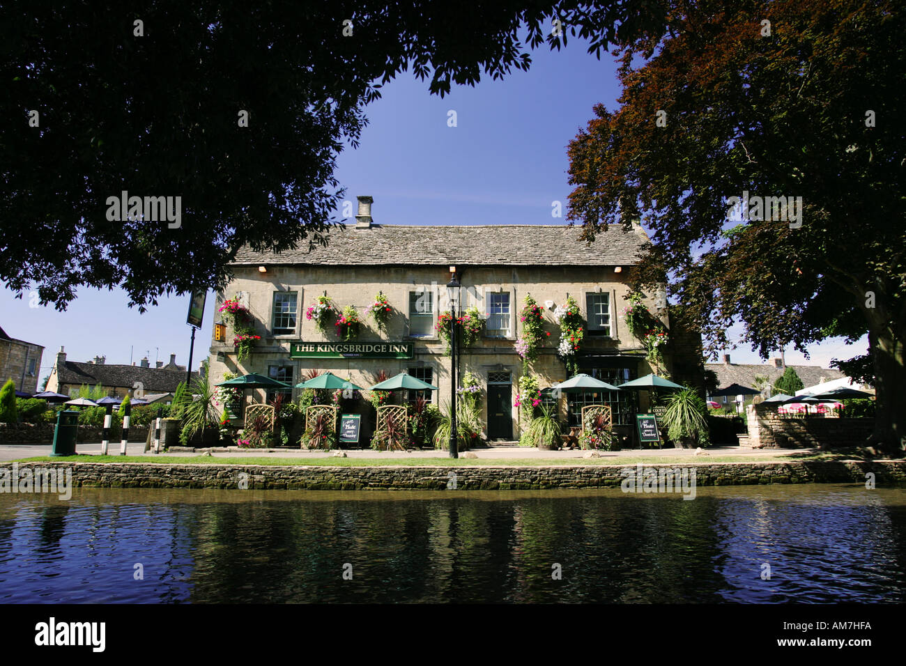 Famous Cotswold pub public house the Kingsbridge Inn viewed across