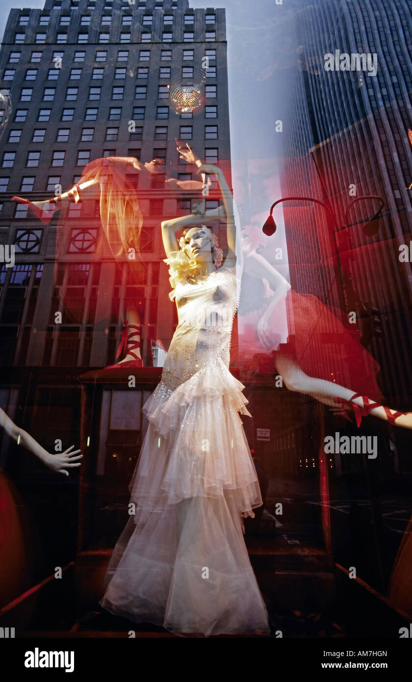 Window with fashion mannequin, high-rise reflecting, New York City, USA Stock Photo