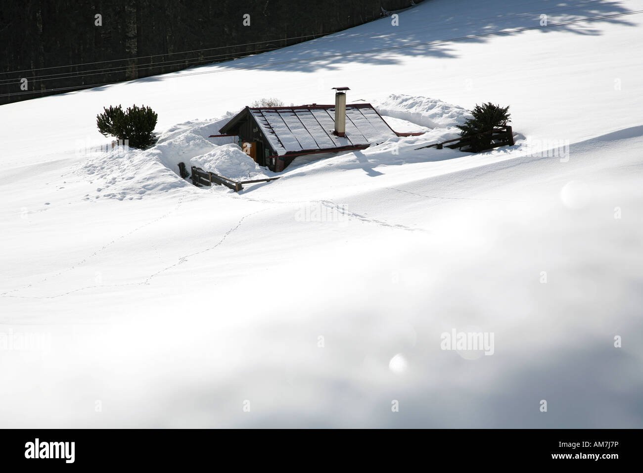 Snowed in mountain hut Stock Photo