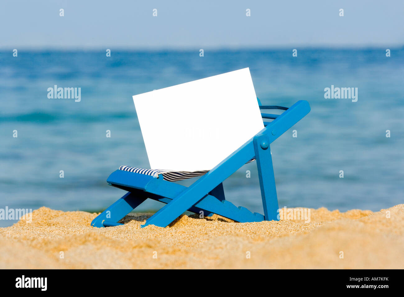 A deckchair with a signpost on the beach Stock Photo