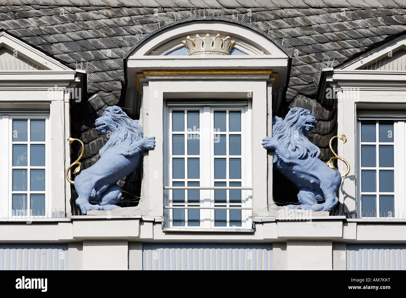 Two blue lions beside an attic window, sculpture at a classicistic house, main market place, Trier, Rhineland-Palatinate, Germa Stock Photo