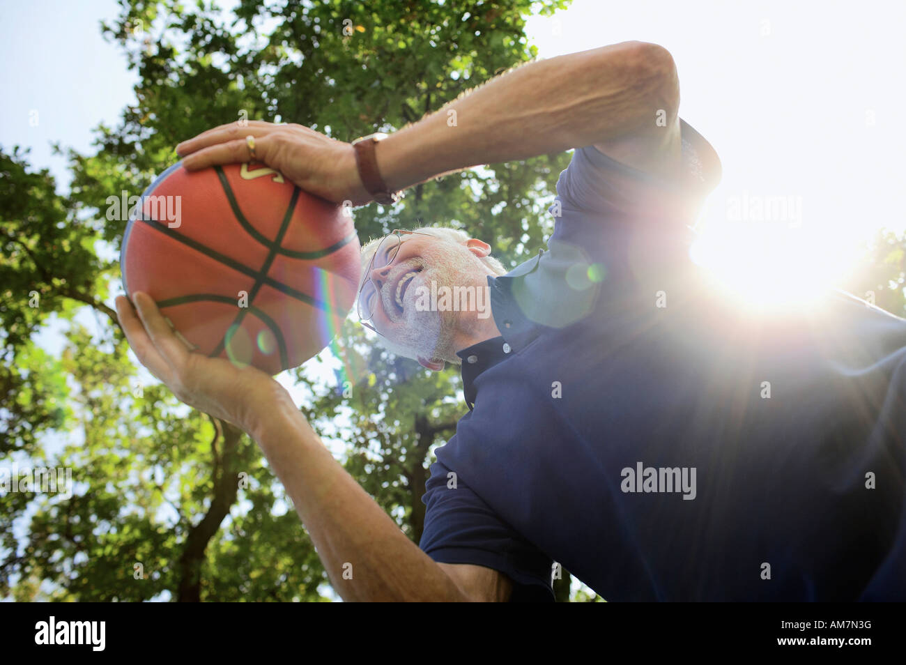 Bestager 60+ playing ball Stock Photo
