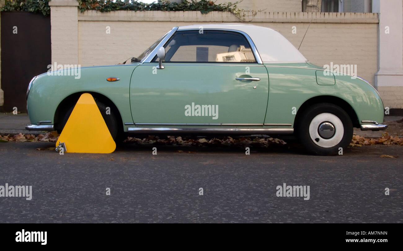 Nissan Figaro clamped in London street Stock Photo