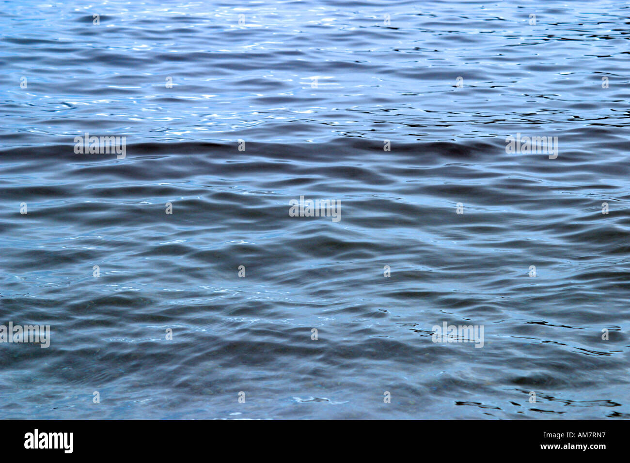 Sun reflecting in the water surface Stock Photo - Alamy