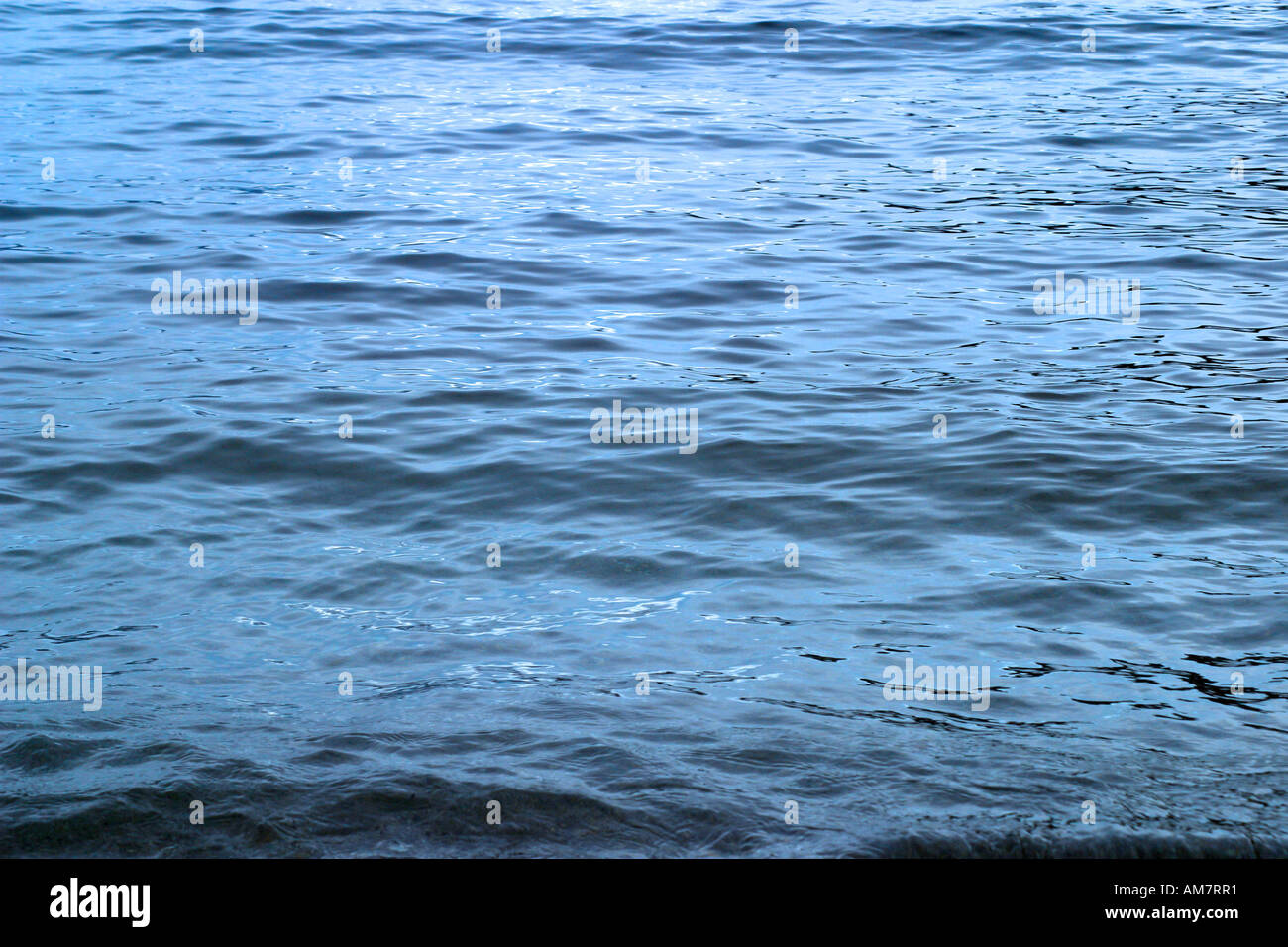 Sun reflecting in the water surface Stock Photo - Alamy