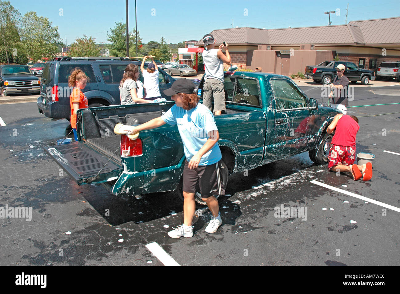 Teen church group has a donation car wash to help victims of Hurricane