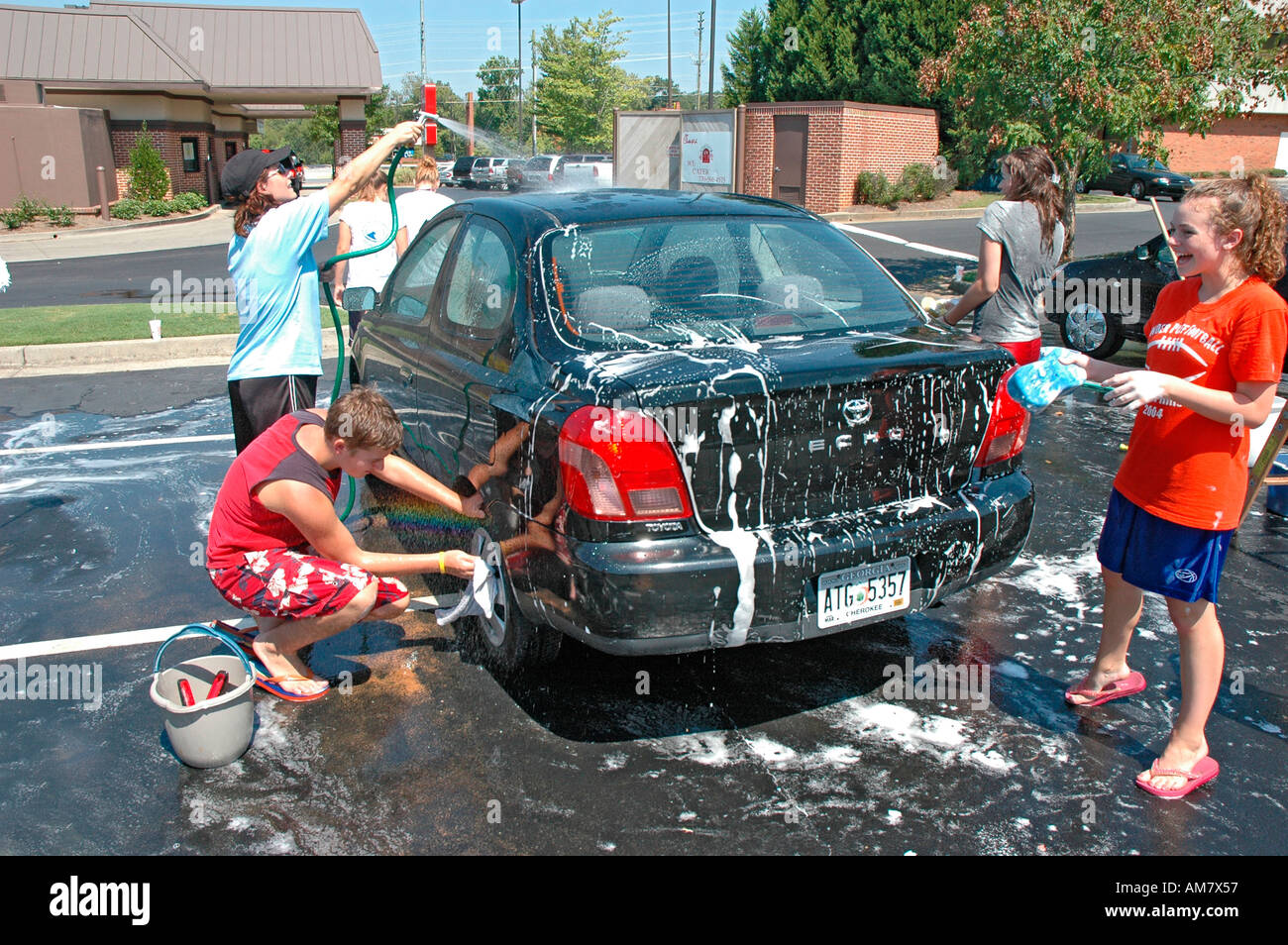 Teen church group has a donation car wash to help victims of Hurricane