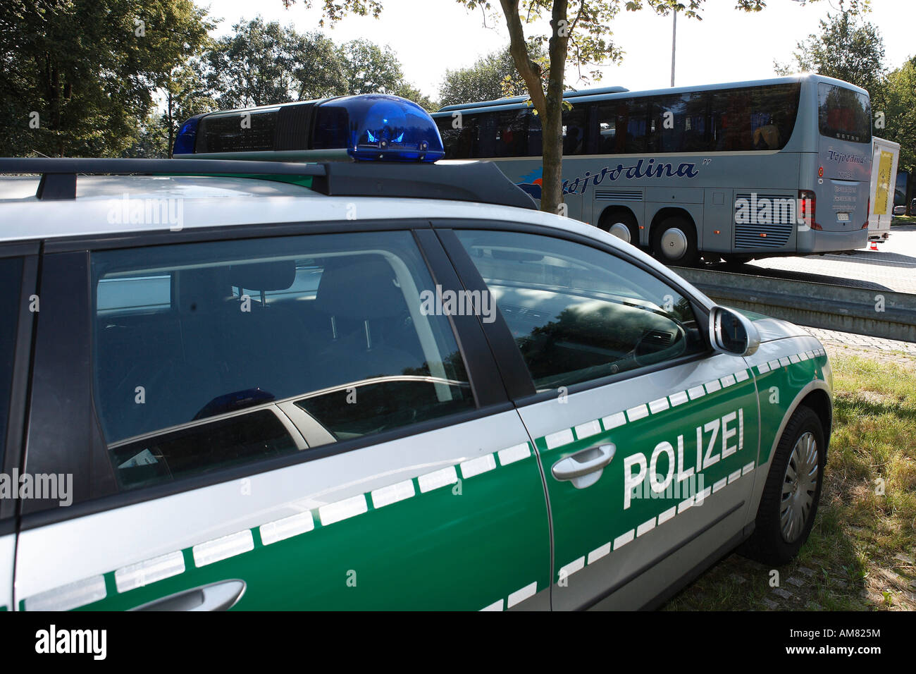 Police checking coaches at motorway station Koeln-Koenigsforst, Roesrath, North Rhine-Westphalia, Germany Stock Photo