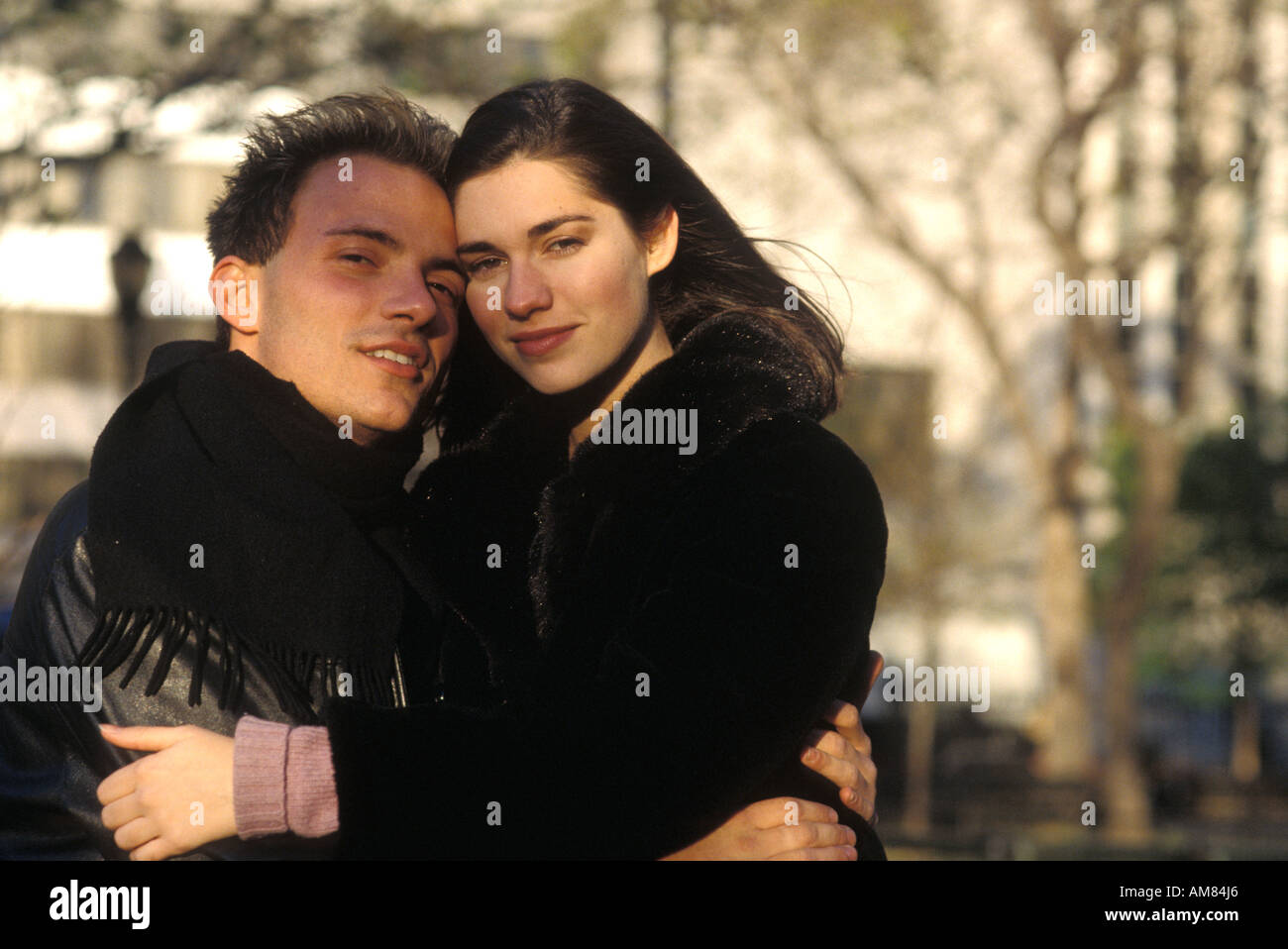 Happy young couple hugging hi-res stock photography and images - Alamy