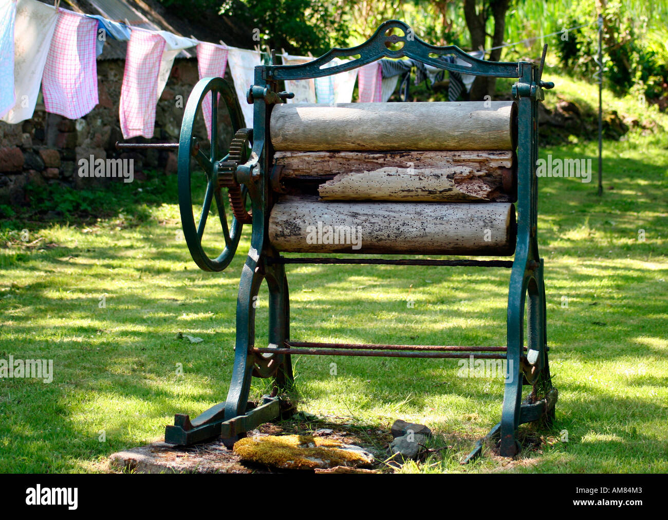 Old fashinoned wooden mangle in a garden Stock Photo