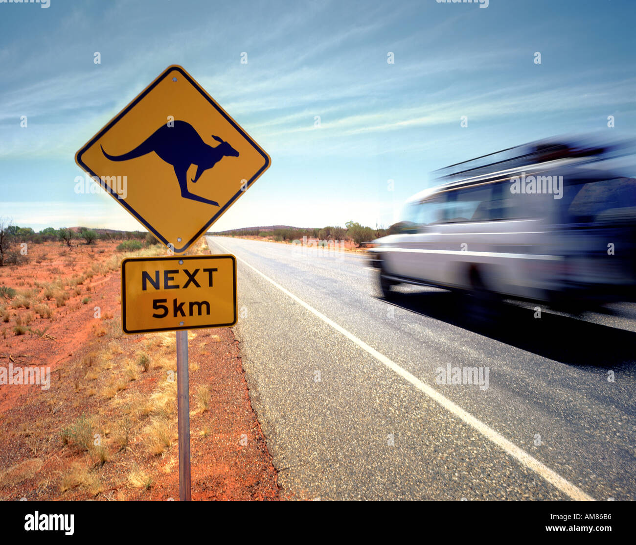 Australia outback, A jeep passes a kangaroo warning sign in The Northern Territory Australia Stock Photo