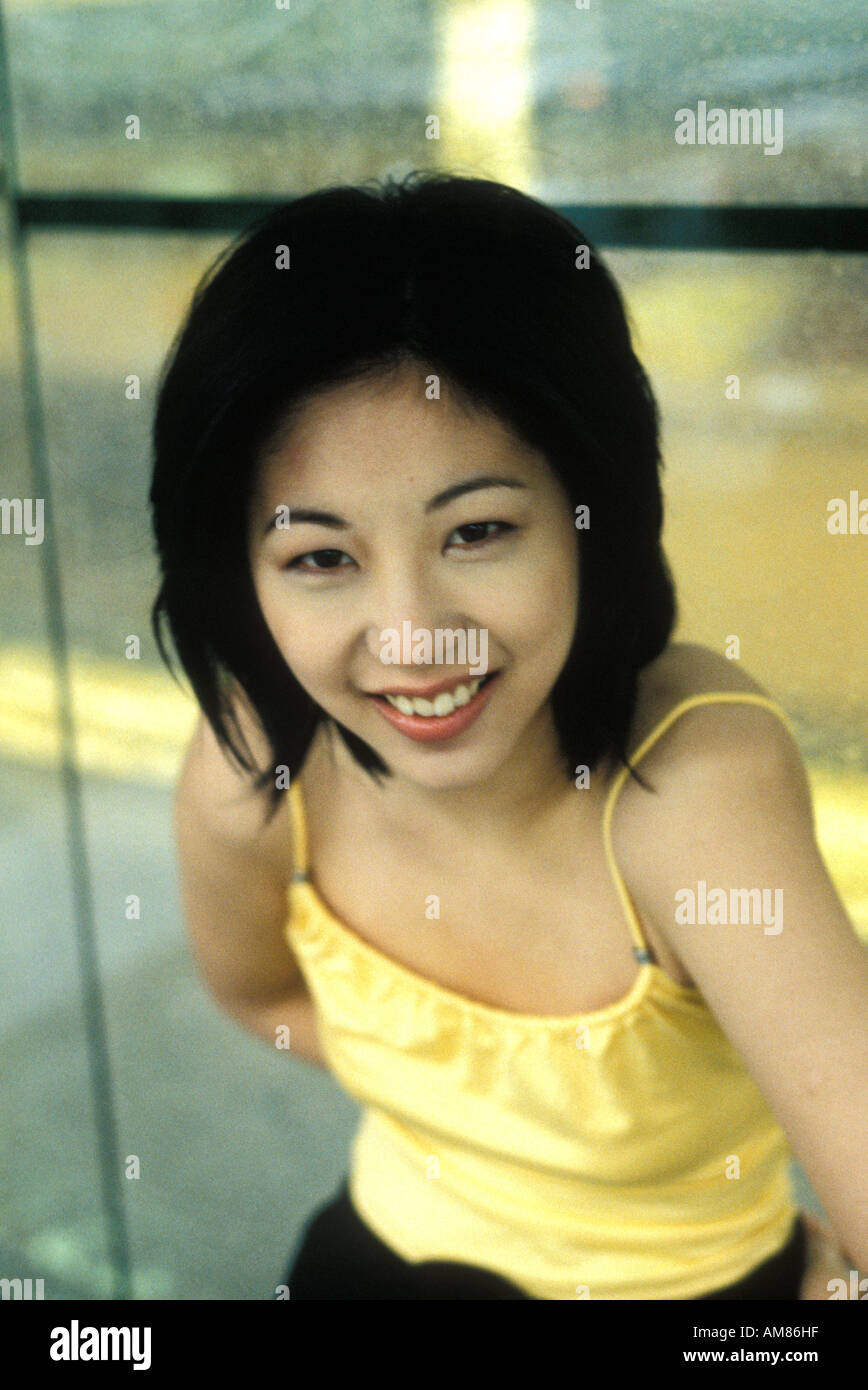 Woman wearing yellow top hi-res stock photography and images - Alamy