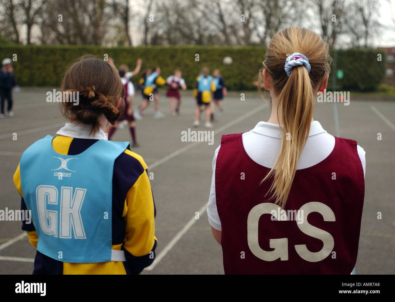 Girls playing netball at a school in England UK Stock Photo