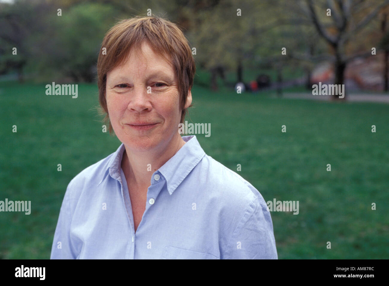Smiling mature brunette woman hi-res stock photography and images - Alamy