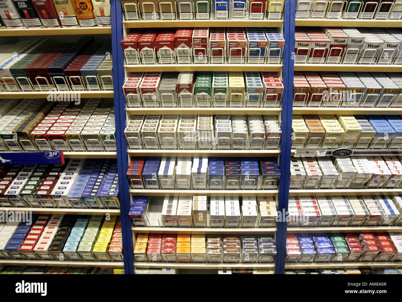 Cigarette and tabacco packs on a shelf Stock Photo