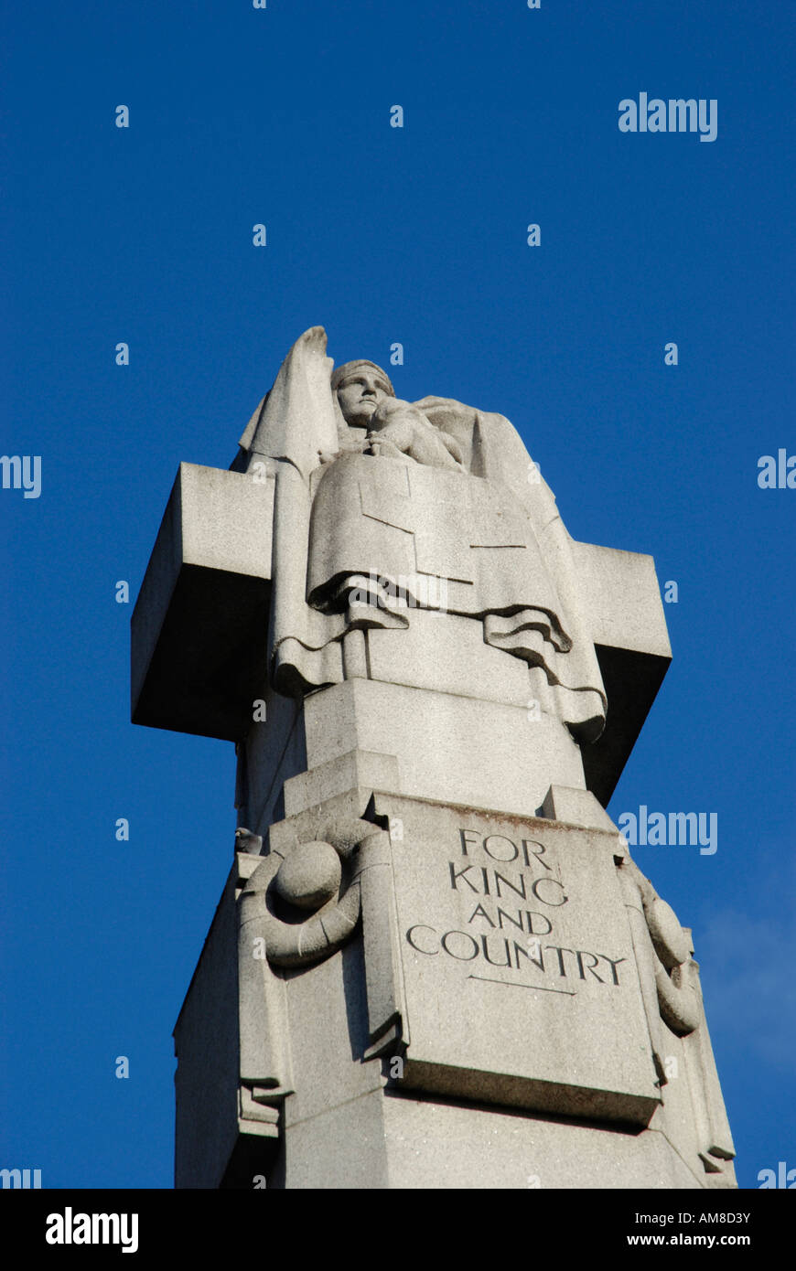 Stone war memorial showing statue of a nurse and the words For King and Country London England UK Stock Photo